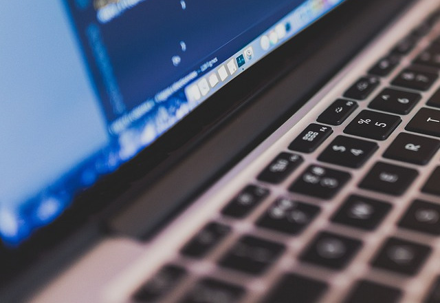 coding programming working macbook laptop office desk